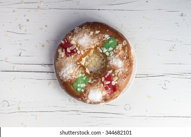 Kings cake, Roscon de Reyes, spanish traditional sweet to eat in Christmas in dark background