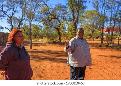 Kings Creek, Australia - Aug 21, 2019: Australian Aboriginal Native Guides Shows The Bush Plants Used During The Traditional Ceremonies Of Local Indigenous.