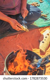 Kings Creek Station, Northern Territory, Australia - Aug 21, 2019: Australian Aboriginal Woman Shows The Traditional Hand Made Local Crafts Decorated With Fire Burns. Karrke Aboriginal Cultural Tour.