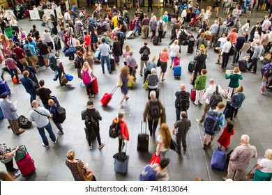 KINGS CROSS TRAIN STATION, LONDON, UK - JULY 21, 2016. An Aerial View Of The Crowded Concourse At Kings Cross Station With Passengers And Commuters Waiting For Information About Their Delayed Trains.