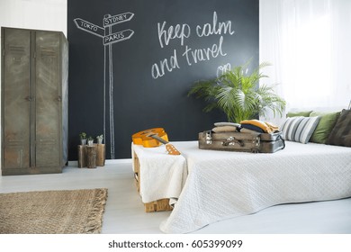 King-size Bed In Cozy Bedroom With Chalkboard Wall