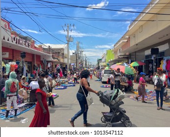 Kingston / Jamaica - March 2017: People in Kingston walking down the street and shopping during trade days.