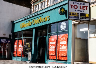 Kingston, London UK, April 7 2021, Ultimate Outdoors Shop Or Store Front With Discount Stock Sale Sign In Window And No People