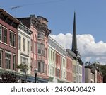 Kingston, NY - May 28, 2024: View of historic buildings with shops and restaurants on Wall street at Front streets in Stockade District of downtown Kingston, New York, Hudson Valley.