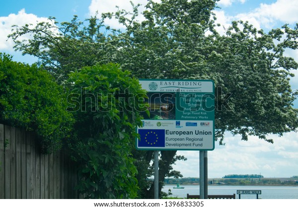 Kingston Upon Hull, Britain, UK - 12th May 2019:\
Street sign directing to Hessle foreshore at the Humber Bridge in\
Kingston upon Hull, East Riding (City of Culture 2017). European\
Union sign symbol