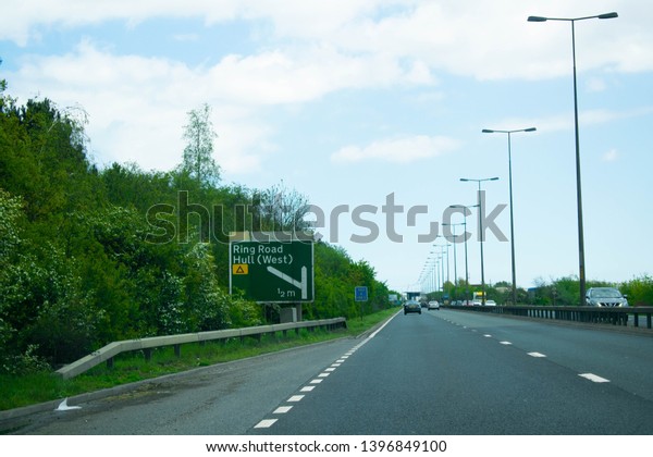 Kingston Upon Hull,\
Britain, UK - 12th May 2019: Road sign directing to ring road, West\
Hull, Hull City Centre. East Yorkshire, United Kingdom (Hull was\
city of Culture 2017) 