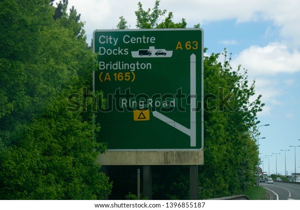 Kingston Upon Hull, Britain, UK - 12th May 2019:\
Road sign directing to Hull City Centre, Hull ferry terminal docks\
and Bridlington seaside. East Yorkshire, United Kingdom (Hull city\
of Culture 2017)