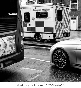 Kingston Upon Thames, London UK March 26 2021, A Car Bus And Ambulance On A High Street, CLose Up With No People