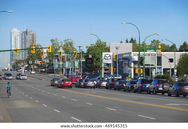 KINGSWAY,\
BURNABY, CANADA - AUGUST 15, 2016: Biking is popular in Canada\'s\
city, even the car traffic is not heavy. More residents enjoy to\
use bike to travel in the city to\
work.