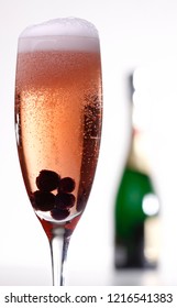 Kir royal cocktail with blueberries