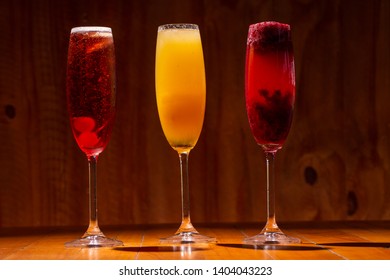 Kir royal, imperial and bellini cocktail on wood background