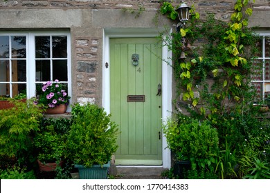 Kirkby Lonsdale ,Cumbria, England, Britain, June 13th 2020, Pretty Cottage Door With Flowers And Plants