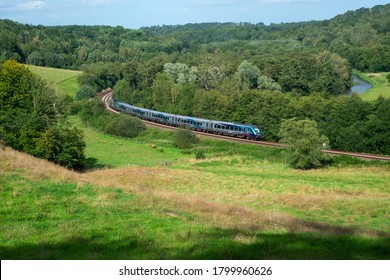 Kirkham Abbey, East Yorkshire, UK August 2020 Trans Pennine Express From Scarborough To Liverpool With Locomotive 68027 Pushing The Train Winds Its Way Pass Kirkham Abbey. New Trains. Modern.