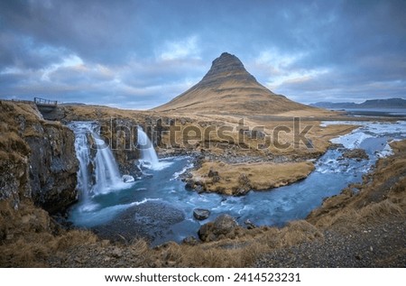 Kirkjufell mountain and Kirkjufellsfoss in Iceland                               