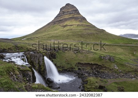 Kirkjufellsfoss, nestled near the iconic Kirkjufell mountain, is a picturesque waterfall in Iceland. The scenic combination of mountain and cascading waters creates a captivating natural tableau.