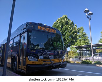 Kirkland, WA / USA - Circa August 2020: A King County Metro Bus Displaying Masks Required On Their Marquee.