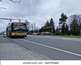 Kirkland, WA / USA - Circa January 2020: King County Metro Transit Bus Pulling Up To A Bus Stop, Heading Toward Bellevue.