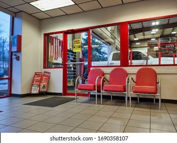 Kirkland, WA / USA - Circa January 2020: View Of The Waiting Area Inside A Discount Tire Shop With A Window Into The Maintenance Area.