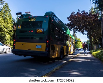 Kirkland, WA / USA - Circa May 2020: Street View Of A Passenger Getting Off A King County Metro Bus.