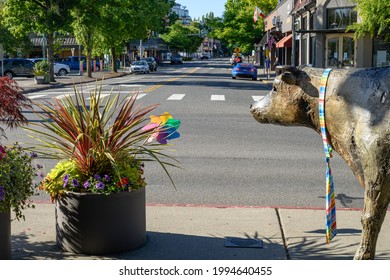 Kirkland, WA, USA - June 20, 2021; Downtown view of Kirkland Washington along Lake Street.  Planter and artwork is decorated in support of the LGBTQ community