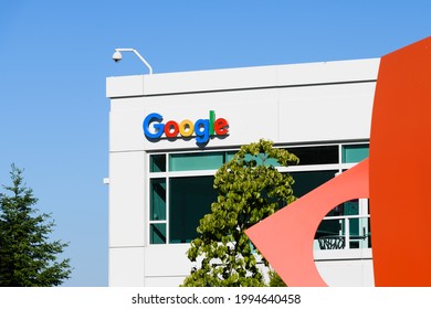 Kirkland, WA, USA - June 20, 2021; Google corporate logo on a building on the Kirkland Washington Campus.  A security camera is on the corner of the building