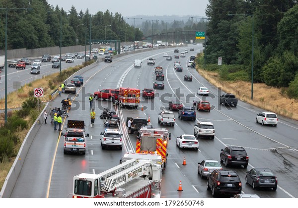 Kirkland, Washington /\
USA - August 6 2020: Car accident blocking 3 lanes of traffic on\
Interstate 405\
(I-405)