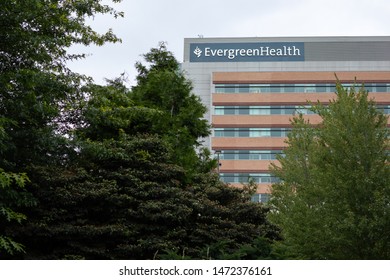 Kirkland, Washington / USA - July 7 2019: Evergreen Health Center and Hospital in Kirkland's Totem Lake neighborhood, with natural framing and space for text