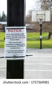 Kirkland, Washington / USA - March 22 2020:  Public Health Closure Notice On A Basketball Hoop During The COVID-19 Pandemic