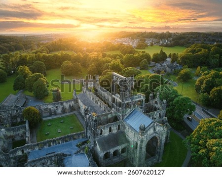 Kirkstall Abbey's Majestic Ruins Surrounded by Verdant Landscape - Sunset Drone View