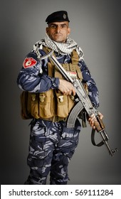 Kirkuk, Iraq - Januaty 24, 2017: Iraqi Man With Official Army Dress Isolated Inside Studio