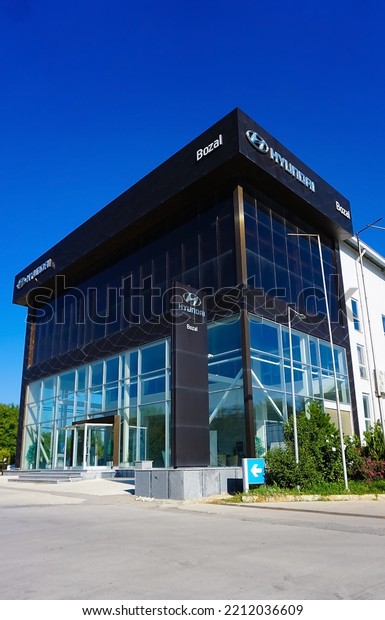Kirov, Russia - August 2021:\
Hyundai logo on the showroom building on a sunny day. Hyundai is a\
South Korean manufacturer of automobiles and commercial\
vehicles