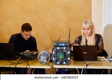 Kirov, Russia - January 24, 2019: Female Master Of Ceremonies And Male DJ About The Music Center And The DJ Booth During The Wedding Celebration In Russia