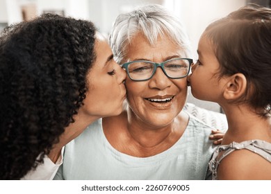 Kiss, affection and children with grandmother for love, birthday or mothers day. Gratitude, care and an elderly woman with a baby and daughter kissing for appreciation, caring and loving at home - Shutterstock ID 2260769005