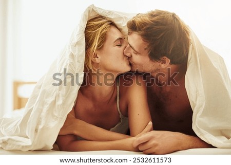 Similar – Happy young couple in love kissing under duvet cover