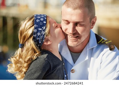 Kiss, child and father with uniform for love relationship, navy seal and military hero with support. Dad, young girl and embrace with marine soldier for happy reunion or goodbye and patriotic service - Powered by Shutterstock