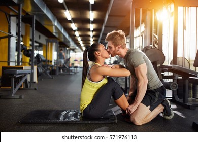 Kiss from fitness partner as prize for well done exercise - Powered by Shutterstock