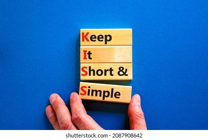 KISS keep it short and simple symbol. Concept words KISS keep it short and simple wooden blocks. Beautiful blue table, blue background. Business KISS keep it short and simple concept. Copy space.