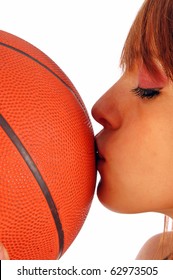 A kiss on the ball of basketball as a sign of love for sports