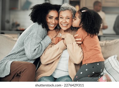 Kiss, portrait and grandmother with girl and woman on a sofa, hug and happy in their home together. Kissing, face and excited senior woman with adult daughter and grandchild on couch, bond and smile - Shutterstock ID 2276429311