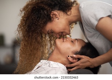 Kisses for the Mrs. Shot of an affectionate couple sharing a kiss at home. - Powered by Shutterstock