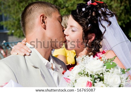 kissing bride and groom