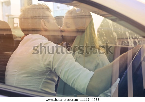 Kissing in the\
car\

