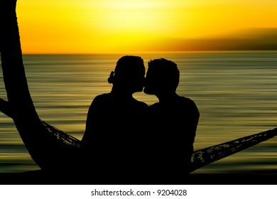 Kissing couple silhouette at sunset - Powered by Shutterstock