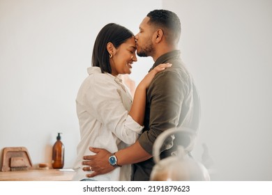 Kissing, Relaxed And Romantic Couple Enjoying Love, Bonding And Special Moment Together At Home. Caring Husband And Wife In A Loving Relationship Sharing Quality Time, Showing Affection And Care