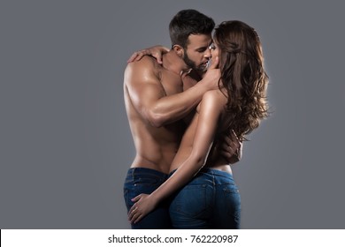 Kissing sexy couple in embrace