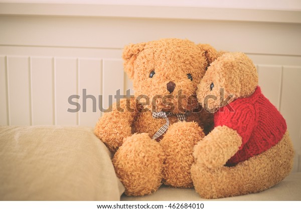 two teddy bears kissing