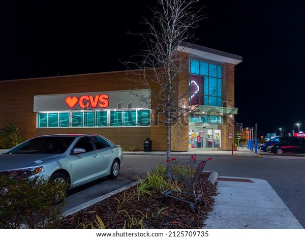 Kissmmee, Florida - February 4,\
2022: Night View of CVS Pharmacy Building Exterior. CVS Health\
Acquired Target Corporation\'s Pharmacy and Retail Clinic\
Businesses.