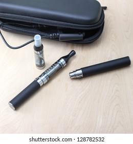 Kit of electronic cigarettes on table