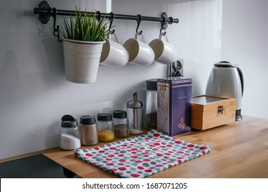 Kitchen Accessories Like Kettle, Coffee Pot, Cups, Napkin, Tea, Coffee And Condiments