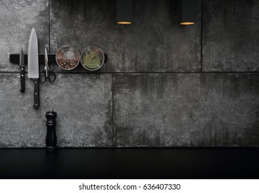 Kitchen Accessories Mounted On The Black Stone Wall , Interior Design